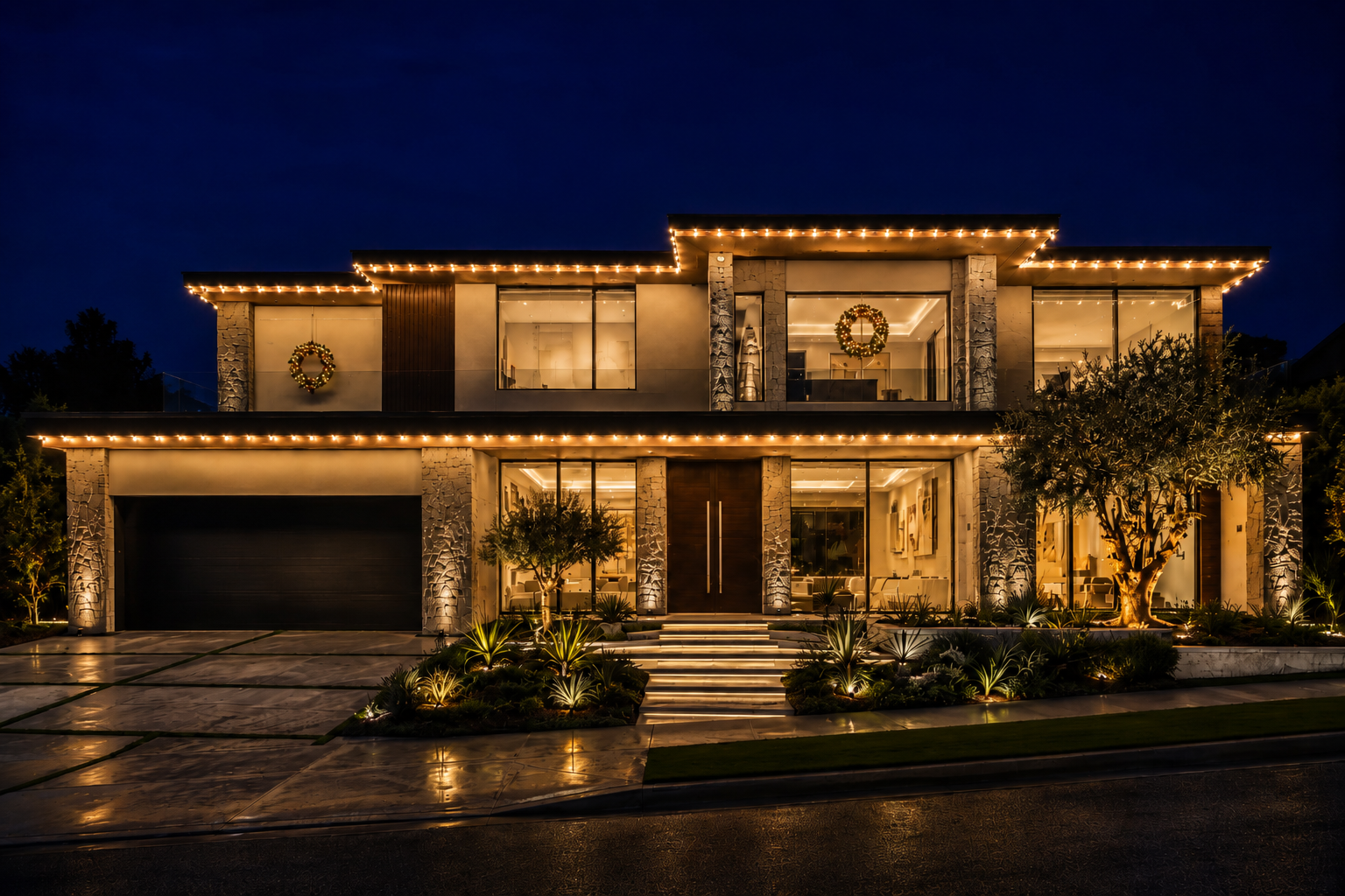 Upscale Los Angeles home at night with warm white permanent holiday lighting along every roofline